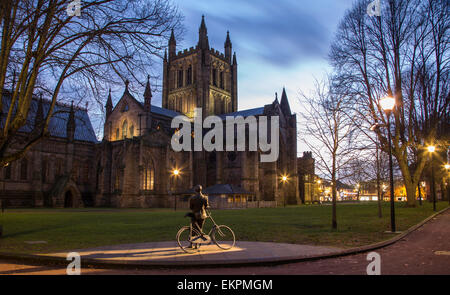 Hereford Cathedral and Statue of Sir Edward Elgar in a corner of Hereford Cathedral Green at dusk , Herefordshire, England, UK Stock Photo
