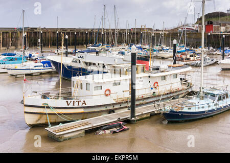 Watchet harbour, Somerset with fishing boats at low tide, England, UK