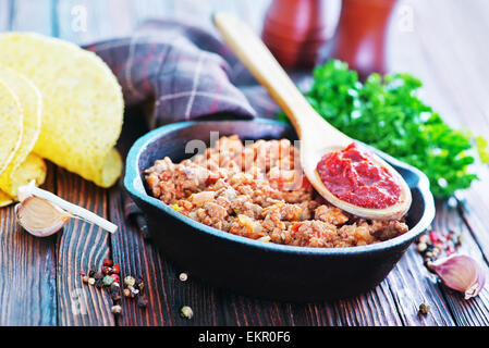 a bowl of fried ground meat with tomatoes ready for tacos Stock Photo