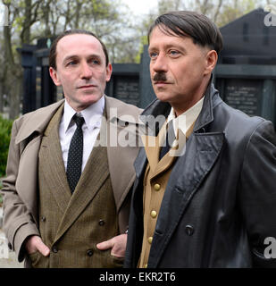 Shooting of the film about Czechoslovak film star Lida Baarova starts in the Olsany cemetary, Prague, Czech Republic, April 13, 2015. Pictured from right: Pavel Kriz and Karl Markovicz. The lead role in the prepared Czech film about actress Baarova, who was mistress of Nazi Germany´s Propaganda Minister Joseph Goebbels before the war, will play Slovak actress Tana Pauhofova. Stock Photo