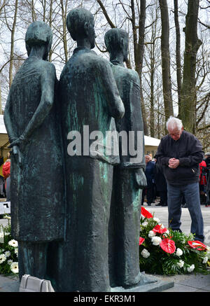 Nordhausen, Germany. 13th Apr, 2015. People commemorate the liberation of the Mittelbau-Dora concentration camp seventy years ago with a wreath laying in Nordhausen, Germany, 13 April 2015. Former prisoners, their relatives and politicians gathered in front of the old crematory for a commemorative ceremony. Beginning in 1943 the Mittelbau-Dora prisoners were forced to build V1 and V2 rockets for the NS regime under unspeakable conditions. Every third of the 60.000 forced labourers died in the camp. Photo: Martin Schutt/dpa/Alamy Live News