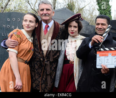 Shooting of the film about Czechoslovak film star Lida Baarova starts in the Olsany cemetary, Prague, Czech Republic, April 13, 2015. Pictured from left: Anna Fialova, Martin Huba, Tana Pauhofova and Karen Mchitarjan. The lead role in the prepared Czech film about actress Baarova, who was mistress of Nazi Germany´s Propaganda Minister Joseph Goebbels before the war, will play Slovak actress Tana Pauhofova. Austrian actor Karl Markovics will play Goebbels, while one of the most famous German actors, Gedeon Burkhard, was cast for the role of actor Gustav Froehlich, who was Baarova´s partner both Stock Photo