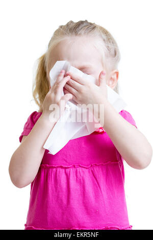 sick child wiping or cleaning nose with tissue isolated Stock Photo