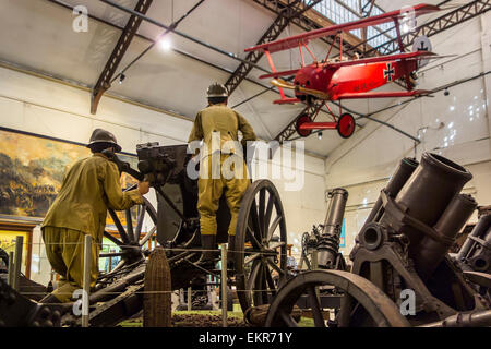 WWI artillery guns and Fokker Dr.I triplane fighter aircraft at the Royal Museum of the Army and of Military History in Brussels Stock Photo