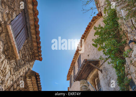 Traditional stone buildings on a narrow street in the medieval walled Eze Village Stock Photo