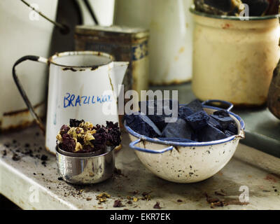Ingredients in a bowl to create a natural dye. Indigo pigment in blocks. Stock Photo