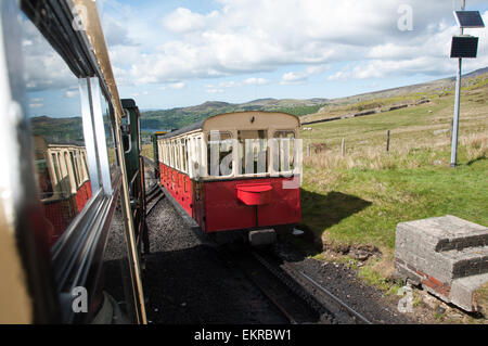 View of the Snowdon Mountain railway locomotion going up the mountain Stock Photo