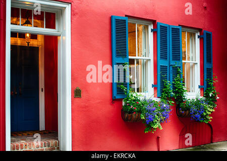 Close Up View of a Colorful Colonial Era House Exterior with a Door and Windows, Charleston, South Carolina Stock Photo