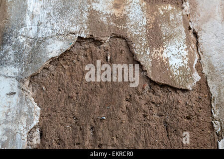 Peru, Cusco.  Falling Plaster Reveals Mud-brick Construction of Houses in Old Residential Areas above the Plaza de Armas. Stock Photo