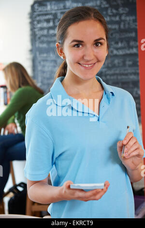 Waitress Ready To Take Order In Cafe Stock Photo