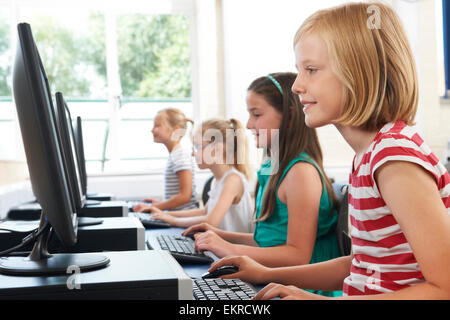 Group Of Female Elementary School Children In Computer Class Stock Photo