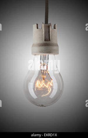 Hanging incandescent light bulb on defocus background Stock Photo - Alamy