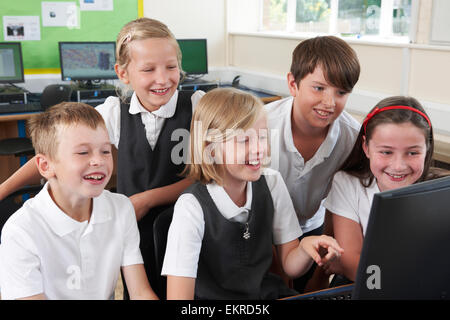 Group Of Elementary Pupils In Computer Class Stock Photo - Alamy