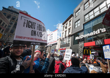 Construction workers join fast food workers at a protest in front of a McDonald's restaurant in New York on Saturday, April 4, 2015. The workers are advocating that fast food restaurants adopt a $15 per hour living wage for their employees. This is part of a series of events leading up to the National Day of Action on April 15 where workers in 200 cities will protest for wages, unions and better jobs. (© Richard B. Levine) Stock Photo