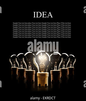Light bulbs in rows with single one shinning, isolated on black background Stock Photo