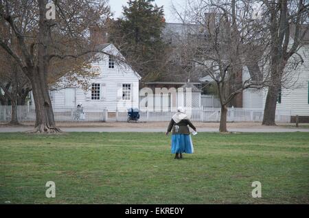 A reenactor walks in Colonial Williamsburg Stock Photo