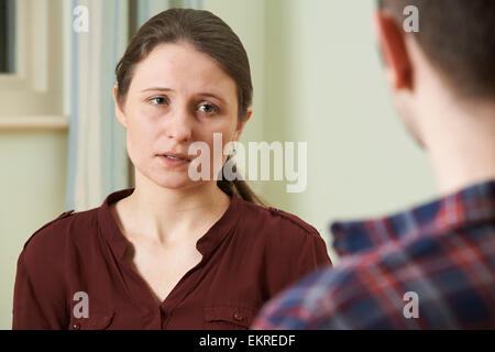 Depressed Young Woman Talking To Counsellor Stock Photo