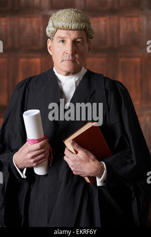 Portrait Of Male Lawyer In Court Holding Brief And Book Stock Photo