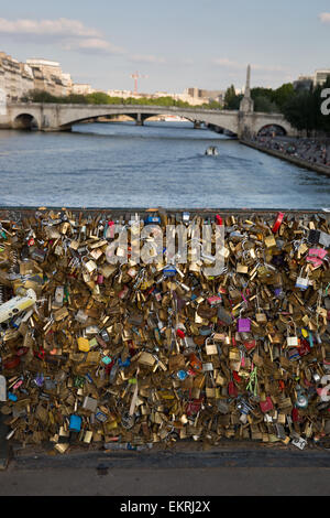 Padlocks fastened to the railing of the Pont des Arts (love lock bridge) in Paris, France Stock Photo