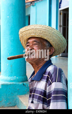 A Cuban man in Vinales smoking a cigar Stock Photo