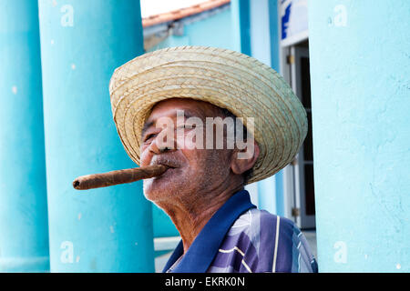 A Cuban man in Vinales smoking a cigar Stock Photo