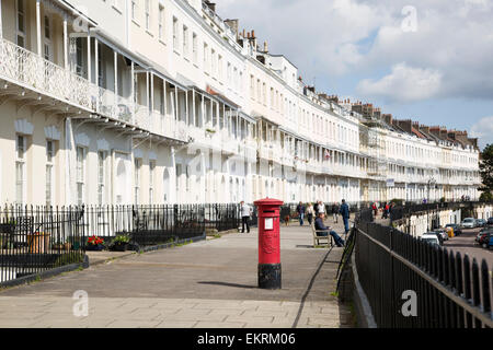 Red post box on Royal York Crescent residential street in Clifton, Bristol. Stock Photo