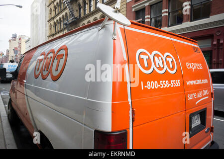 A TNT Express delivery van parked in Soho in New York on Tuesday, April 7, 2015. FedEx announced it will buy the Dutch delivery service TNT Express for 4.4 billion euros. FedEx gains TNT's extensive ground service complemented by FedEx' fleet of planes. (© Richard B. Levine)