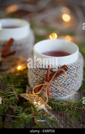 Mulled wine in mug with mug warmer Stock Photo
