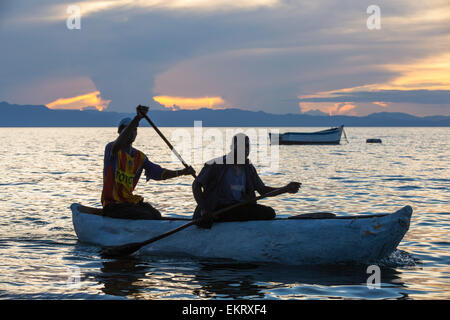 Fisherman in a traditional dug out canoe at Cape Maclear, on Lake Malawi, Malawi, Africa. Stock Photo