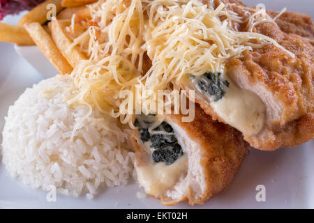 Stuffed schnitzel with french fries and rice,cheese Stock Photo