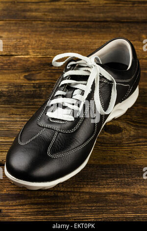 black leather man's shoe on white background Stock Photo - Alamy