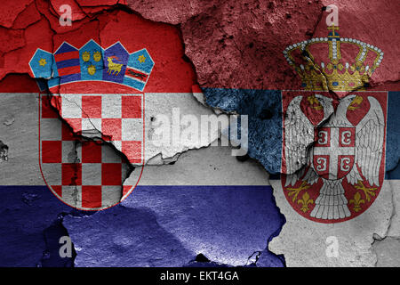 flags of Croatia and Serbia painted on cracked wall Stock Photo