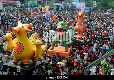 Dhaka, Bangladesh. 14th Apr, 2015. Bangladeshi participate in a rally to celebrate the Bengali New Year or Pohela Boishakh in Dhaka, Bangladesh, April 14, 2015. Bangladeshi people celebrated the Bengali New Year across the country on Tuesday. Credit:  Shariful Islam/Xinhua/Alamy Live News Stock Photo