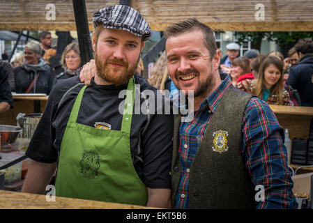 Portrait of males working at a food stand. Annual end of summer festival-Cultural Festival (Menningarnott),  Reykjavik, Iceland Stock Photo