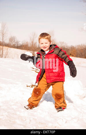 boy ready to  throw snowball Stock Photo