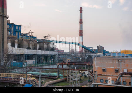 CHP with high chimneys in Poland at dusk Stock Photo