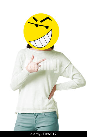 Young woman with a happy emoticon face in front of her face Stock Photo