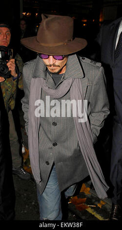 Johnny Depp, wearing fedora hat and sunglasses, leaving 'C London