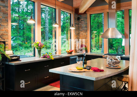 Kitchen Of Ocean-Side Home Features Views Of The Open Water; Port Renfrew, Vancouver Island, British Columbia, Canada Stock Photo