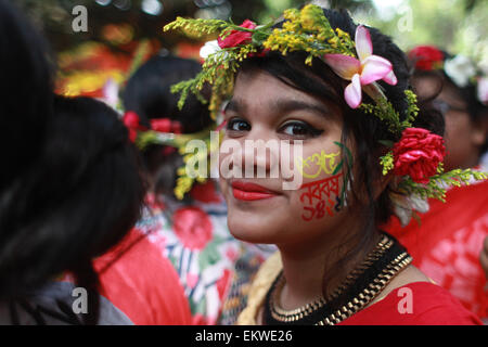 Dhaka, Bangladesh. 14th Apr, 2015. A girl decorated herself with flower to celebrate Bengoli New Year 1422.Bangladeshi peoples a colorful march to welcome in the Bengali New Year 1422. Shedding the preceding year's glooms to oblivion, people from all walks of life began to welcome the Bangla year 1422 as soon as the sun rises on the horizon. Credit:  ZUMA Press, Inc./Alamy Live News Stock Photo