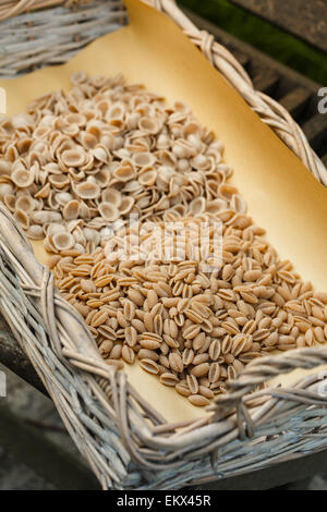 Assorted wholemeal pasta in a basket Stock Photo