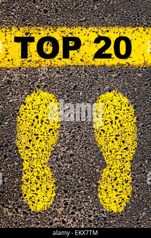 Top Twenty message. Conceptual image with yellow paint footsteps on the road in front of horizontal line over asphalt Stock Photo