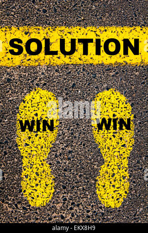 Win Win Solution Message. Conceptual image with yellow paint footsteps on the road in front of horizontal line over asphalt Stock Photo