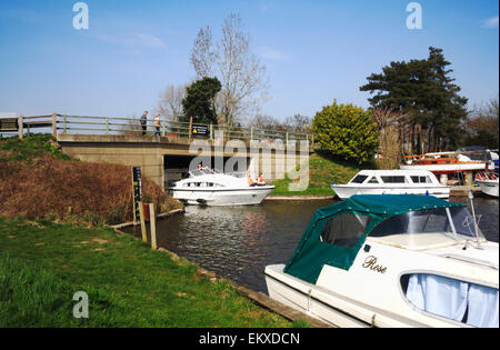 A boat on the River Ant on the Norfolk Broads passing under Ludham Bridge, Norfolk, England, United Kingdom. Stock Photo