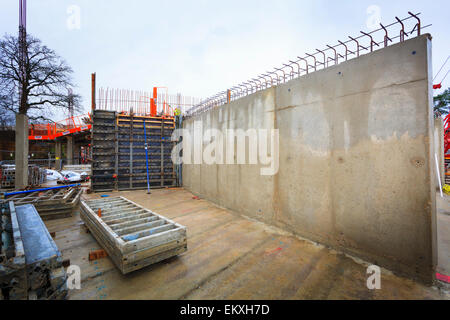 Poured concrete reinforced walls on building site. Stock Photo