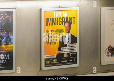 Euston Station, London, UK. 14th April 2015. A poster campaign to celebrate immigration, called 'I am an Immigrant', with poster across London stations. The images show 15 immigrants from different occupations from a barrister to a mental health nurse and a fireman. The campaign was created by the Movement Against Xenophobia. Credit:  Matthew Chattle/Alamy Live News Stock Photo
