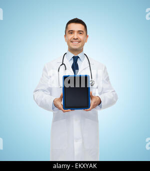 smiling male doctor with tablet pc Stock Photo
