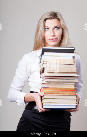 girl holding a stack of books Stock Photo - Alamy