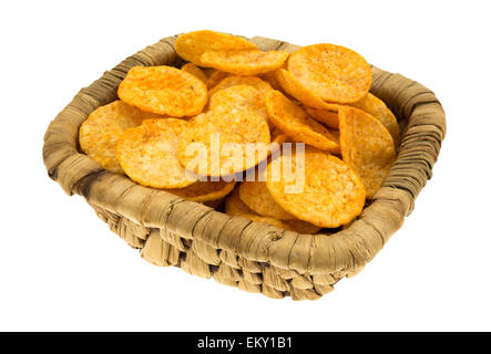 A wicker basket filled with barbecue flavored potato chips on a white background. Stock Photo