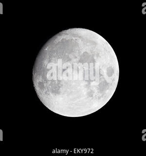 Moon (waxing gibbous) shining against night black sky Stock Photo